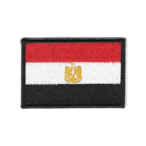 May include: Embroidered patch depicting the Egyptian flag. The rectangular patch has horizontal stripes of red, white, and black, with a gold emblem in the centre. The patch is bordered by a black edge.