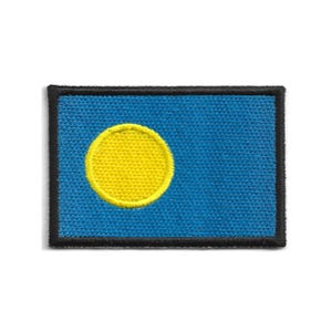 May include: A rectangular patch featuring the flag of Palau. The flag has a light blue background with a yellow circle offset to the left. The patch is bordered with a black trim.
