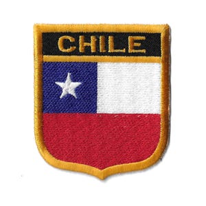 May include: An embroidered patch featuring the Chilean flag. The patch is shaped like a shield with a gold border and the word "CHILE" in black lettering at the top.