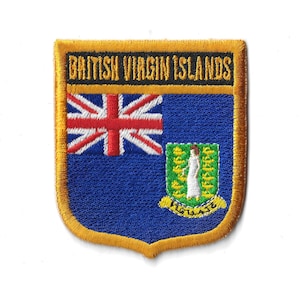 May include: A gold embroidered patch with the British Virgin Islands flag. The flag features a blue background with a red, white, and blue Union Jack in the upper left corner and the coat of arms of the British Virgin Islands in the lower right corner. The patch has a gold border and the words "British Virgin Islands" in black text.