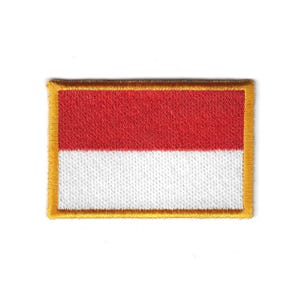 May include: Embroidered patch featuring the flag of Indonesia. The rectangular patch has a red upper half and a white lower half, with a gold border. The flag design is stitched onto a white background.
