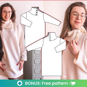 May include: A white turtleneck sweater dress with a button detail on the shoulder. The dress is shown on a model with a black purse.