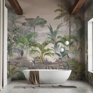 May include: A white bathtub sits in a bathroom with a tropical mural featuring palm trees, birds, and a misty mountain landscape. The mural is painted in shades of green, brown, and blue.
