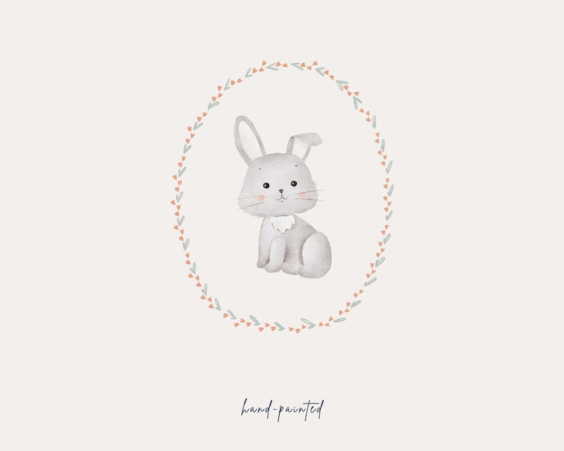 May include: A watercolor illustration of a gray bunny sitting inside a wreath of green leaves and pink flowers. The text "hand-painted" is written below the wreath.