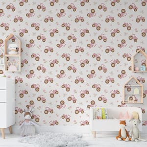 May include: A light-colored wallpaper featuring a repeating pattern of pink tractors and small brown flowers. The tractors have brown wheels and are set against a neutral background. The wallpaper is in a child's room.