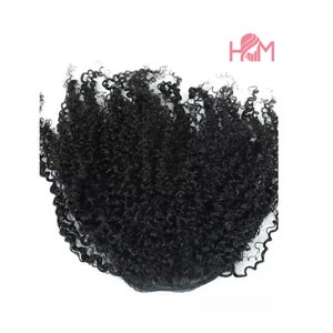 May include: A black curly hair ponytail extension with a black elastic band.