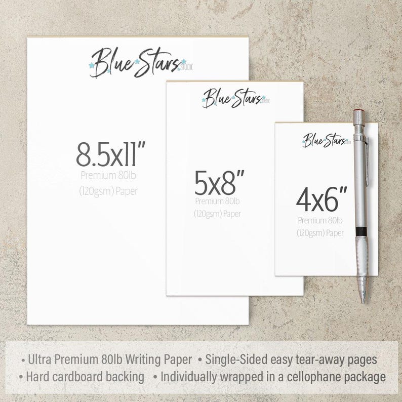 three different sizes of Blue Stars stationery, including 8.5x11", 5x8", and 4x6" paper, as well as a pen. The stationery is labeled as "Ultra Premium 80lb Writing Paper" and "Single-Sided easy tear-away pages". The stationery is also described as "Hard cardboard backing" and "Individually wrapped in a cellophane package".