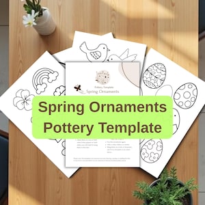 Könnte beinhalten: Ein Set aus drei Keramikbechern mit gesprenkelter, matter Oberfläche. Die Becher sind in Creme-, Hellgrau- und Dunkelgrautönen gehalten. Jeder Becher hat ein schlichtes, minimalistisches Design.