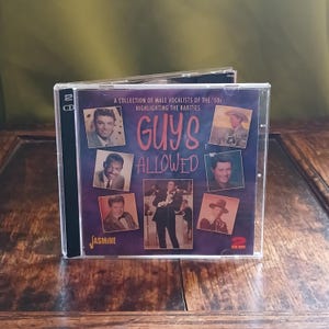 May include: A two-CD set titled "Guys Allowed" featuring a collection of male vocalists from the 1950s. The cover art features a collage of photos of singers against a dark purple background with the title in white.