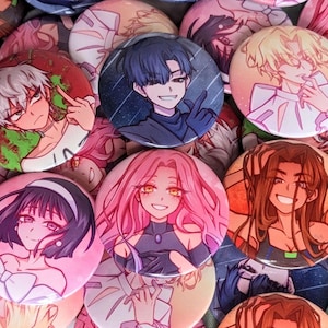 May include: A collection of colorful anime-style character buttons. The buttons feature various characters with different hairstyles, clothing, and expressions.