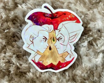 May include: A holographic sticker featuring two stylized faces facing each other, set against a red apple. The apple has a dark stem and a golden core. The sticker has a shiny, iridescent finish.