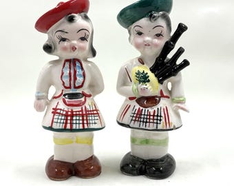 Vintage Japan Scottish Boy playing Bagpipes and Girl Salt Pepper Shakers