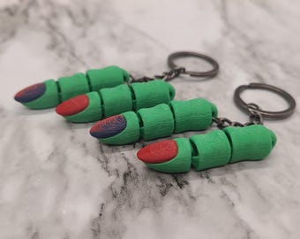 Llavero de dedo de bruja