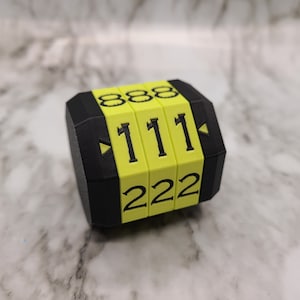 May include: A black and yellow combination lock with the numbers 888, 111, and 222 displayed.