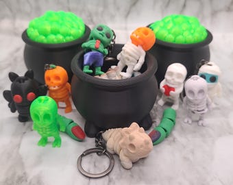 Llaveros flexibles de caldero misterioso de Halloween