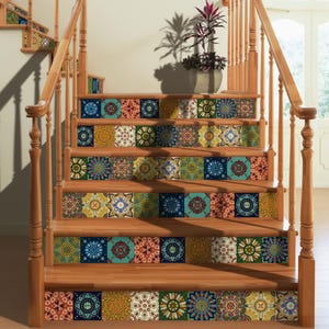 May include: A wooden staircase featuring decorative tile stickers on each riser. The tiles display a variety of intricate, colorful geometric and floral patterns in shades of blue, orange, green, and yellow, creating a vibrant visual display.