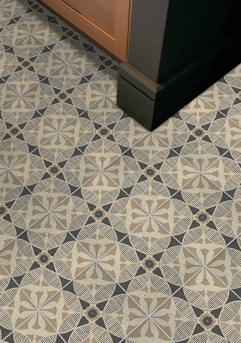 May include: A patterned floor tile with a geometric design in shades of beige and black. The tile features a repeating pattern of circles, stars, and triangles.