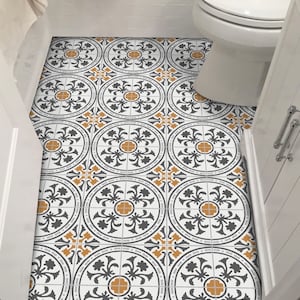 May include: A bathroom floor with black and white patterned tiles with a yellow accent. The tiles are arranged in a repeating pattern.