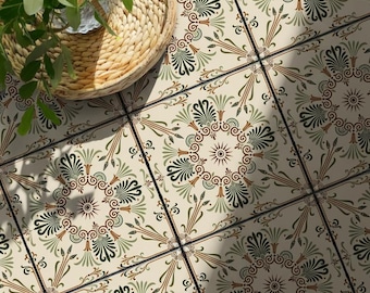 May include: Square ceramic floor tiles featuring a repeating cream background with a symmetrical medallion pattern in shades of olive green, sage, and terracotta. A woven wicker basket containing a green leafy plant sits on the tiled surface.