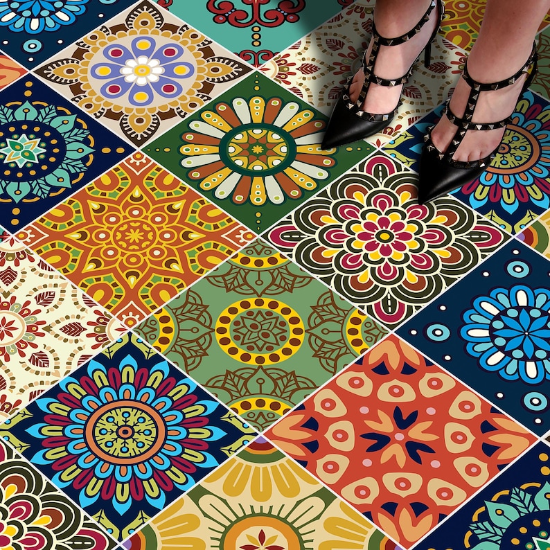May include: A collection of square floor tiles featuring a variety of colorful mandala patterns in shades of blue, orange, yellow, green, and cream. Each tile displays a unique geometric floral design arranged in a repeating grid pattern.