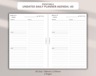 May include: Printable undated daily planner agenda in A5 size. The planner features a layout with sections for priorities, schedule, to-do lists, and notes. The pages are designed with a clean, minimalist aesthetic, with lines and text in black on a white background.