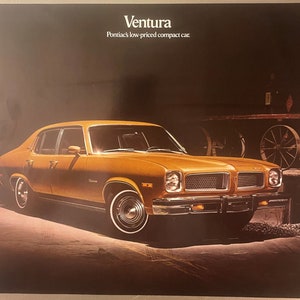 May include: An advert for the Pontiac Ventura, a low-priced compact car. The car is a golden-yellow colour with chrome accents and white-walled tyres. The background is dark, with the car illuminated by a spotlight. The text "Ventura" is at the top.