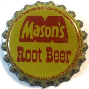 May include: A yellow metal bottle cap with a red and white logo that says "Mason's Root Beer". The text around the edge of the cap reads "Water, Sugar, Corn Sweetener, Caramel Color. Natural and Artificial Root Beer Flavor and Less Than 1/10 of 1% Sodium Benzoate as a Preservative. Carbonated."