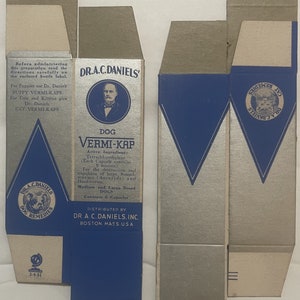 May include: A blue and silver box with the text "DR. A.C. DANIELS' DOG VERMI-KAP" and a picture of a dog. The box contains 8 capsules and is for medium and large breed dogs.