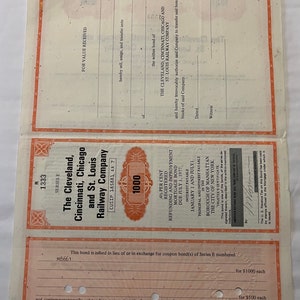 May include: A vintage bond certificate for The Cleveland, Cincinnati, Chicago and St. Louis Railway Company. The certificate is dated July 1, 1977, and is for $1,000. The bond is registered and has a 4% interest rate.