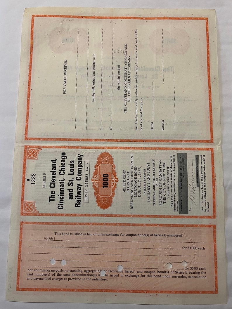 May include: A vintage bond certificate for The Cleveland, Cincinnati, Chicago and St. Louis Railway Company. The certificate is dated July 1, 1977, and is for $1,000. The bond is registered and has a 4% interest rate.