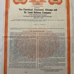 May include: A vintage bond certificate from The Cleveland, Cincinnati, Chicago and St. Louis Railway Company, dated July 1, 1927, for the amount of $1,000. The certificate is printed on a red and white paper with a portrait of a man in the upper left corner.