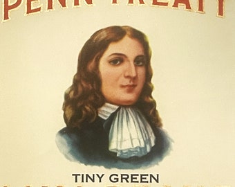 May include: A vintage label for Penn Treaty Tiny Green Lima Beans. The label features a portrait of William Penn in a blue coat and white cravat, against a cream background. The text "Penn Treaty" is in red lettering, and "Tiny Green Lima Beans" is in gold lettering.