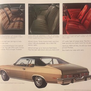 May include: A 1974 Pontiac Ventura Custom Hatchback Coupe in camel beige. The image shows the car's exterior, including the rear with the model year. Interior seat options are also displayed, with text describing features like multi-leaf rear springs and engine specifications.