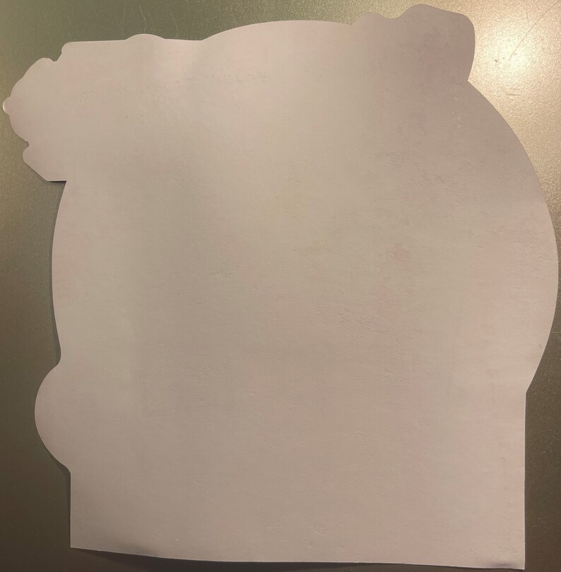 May include: A blank white card with a rounded edge and a decorative design at the top. The card is made of thick paper and has a smooth surface.