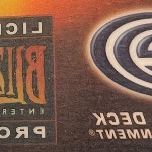 May include: A black and white logo for Upper Deck Entertainment with the text "Upper Deck" and a stylized "E" logo. The logo is on a brown background. The text "Licensed Blizzard Entertainment Product" is also visible in the image.