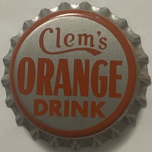 May include: A silver bottle cap with a red border. The text "Clem's ORANGE DRINK" is printed in orange.