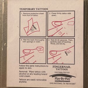 May include: Instructions for applying temporary fingernail tattoos. The instructions include removing the protective sheet, pressing the tattoo firmly, wetting the back with a sponge, and waiting 20-30 seconds before peeling off the backing. The image also includes the text "Fingernail Tattoos" and "Play-By-Play Toys & Novelties".