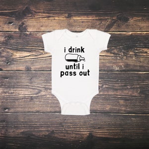 May include: White baby onesie with black text that reads "i drink until i pass out" and a black and white illustration of a baby bottle.