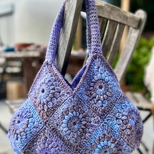 Crocheted shoulder bag made from purple granny squares