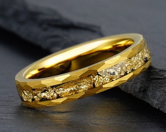 May include: A gold tungsten carbide ring with a hammered finish and a band of gold flakes embedded in the metal.