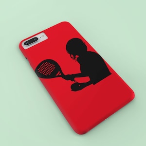 May include: A red phone case with a black silhouette of a person playing paddle tennis.