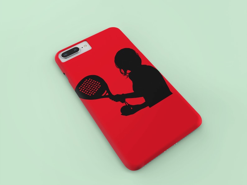 May include: A red phone case with a black silhouette of a person playing paddle tennis.