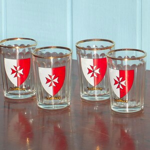 Four vintage shot glasses with Maltese crest image 1