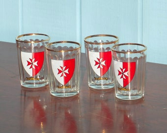 Four vintage shot glasses with Maltese crest