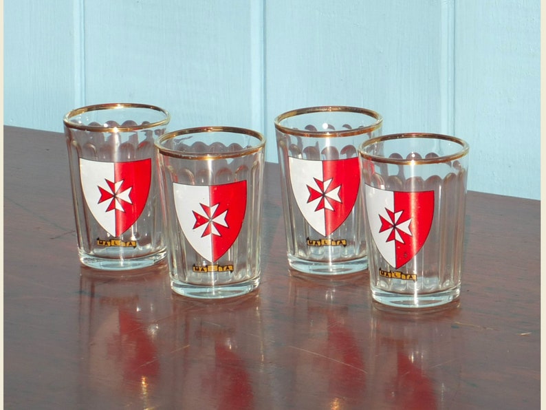 Four vintage shot glasses with Maltese crest image 1