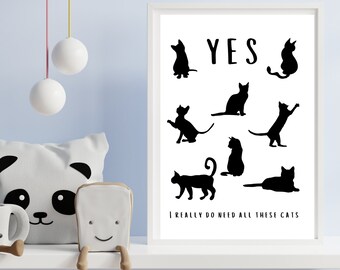 May include: Black and white print with the text "YES" and the phrase "I really do need all these cats". The print features nine black silhouettes of cats in various poses.