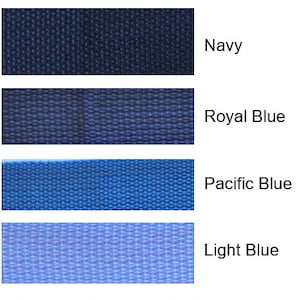 May include: A swatch card displaying six different shades of blue fabric, including purple, navy, royal blue, pacific blue, light blue, and teal.