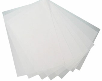 May include: A stack of white translucent sheets of paper.