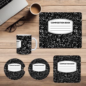 May include: A composition book-themed desk set featuring a mug, mousepad, and coasters. The items have a black and white speckled pattern with a white label that reads "COMPOSITION BOOK". The mug is white with the same design.
