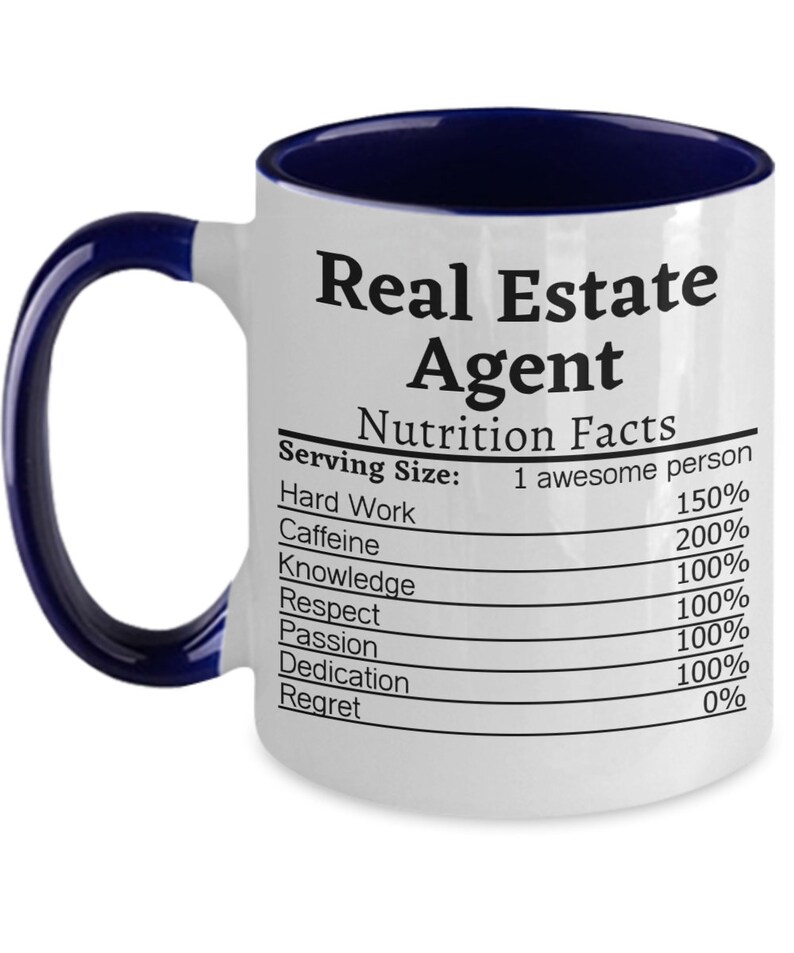 May include: White ceramic coffee mug with a blue rim. The mug has a graphic of a nutrition facts label with the text "Real Estate Agent" and a list of qualities with percentages.